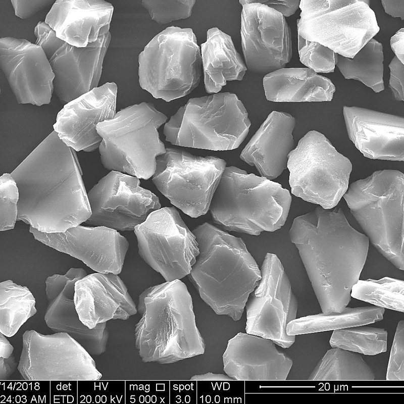 HDY single crystal at 5000x, complete crystal structure and smooth facets, 20 micron scale bar