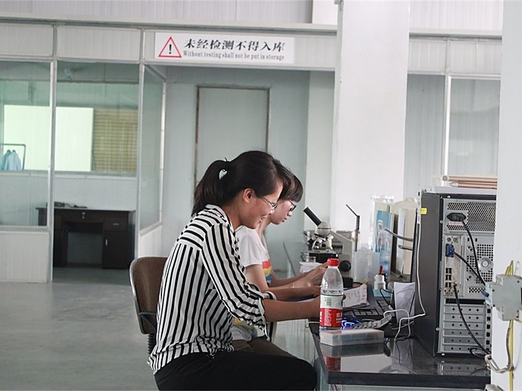 HNHONGXIANG technician monitoring diamond powder production data in the plant